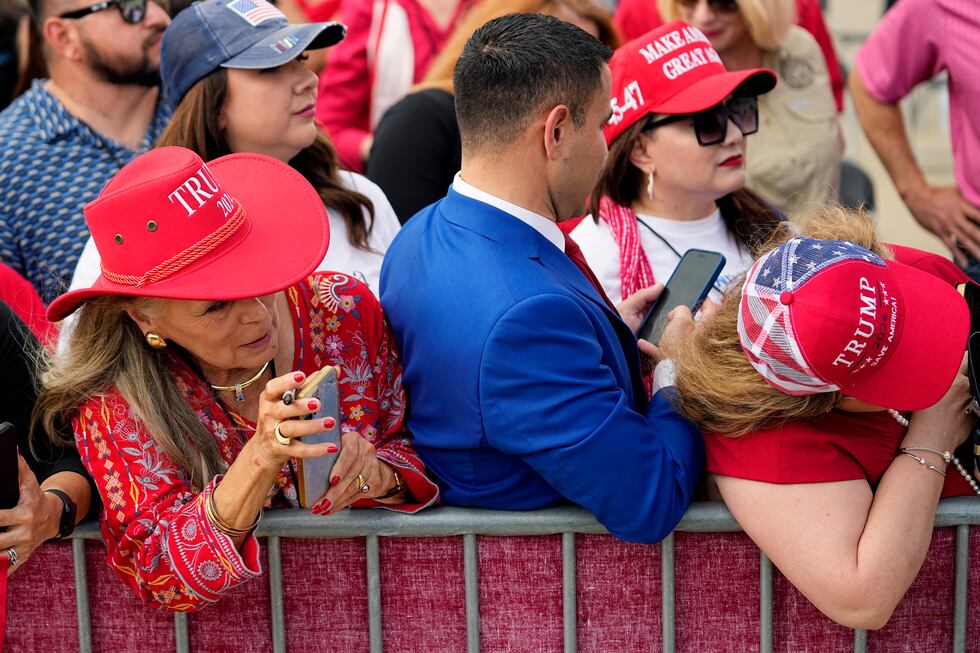 Supporters wait to greet Republican presidential candidate and former President Donald Trump...
