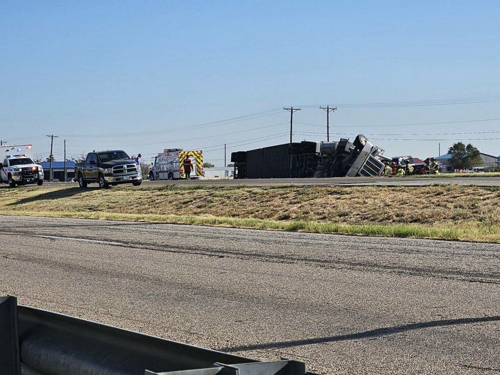 Cattle loose after truck turns over on I-27