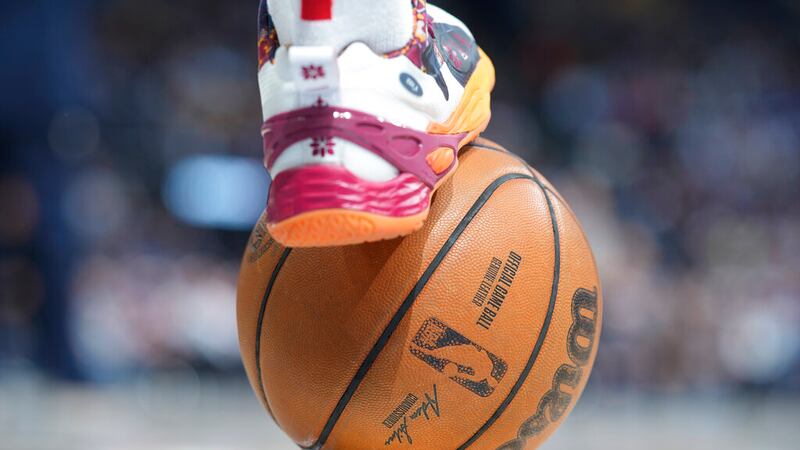 Atlanta Hawks guard Bogdan Bogdanovic (13) places his shoe on the basketball in the second...