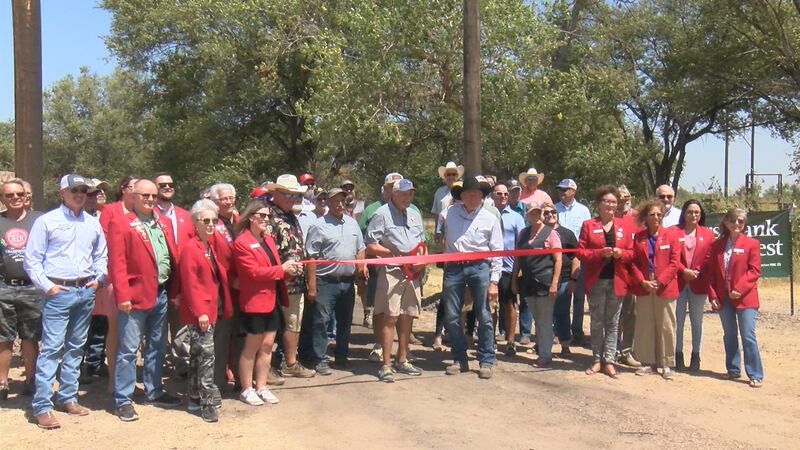 Amarillo Gun Club members pose for pictures during ribbon cutting event.