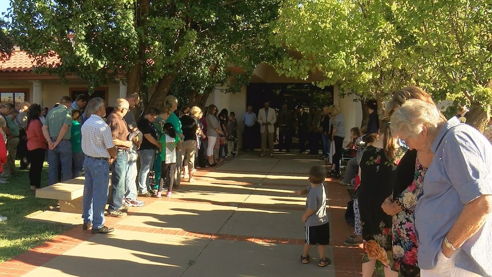 Community members gather to observe the one year anniversary of the Clovis-Carver Public...