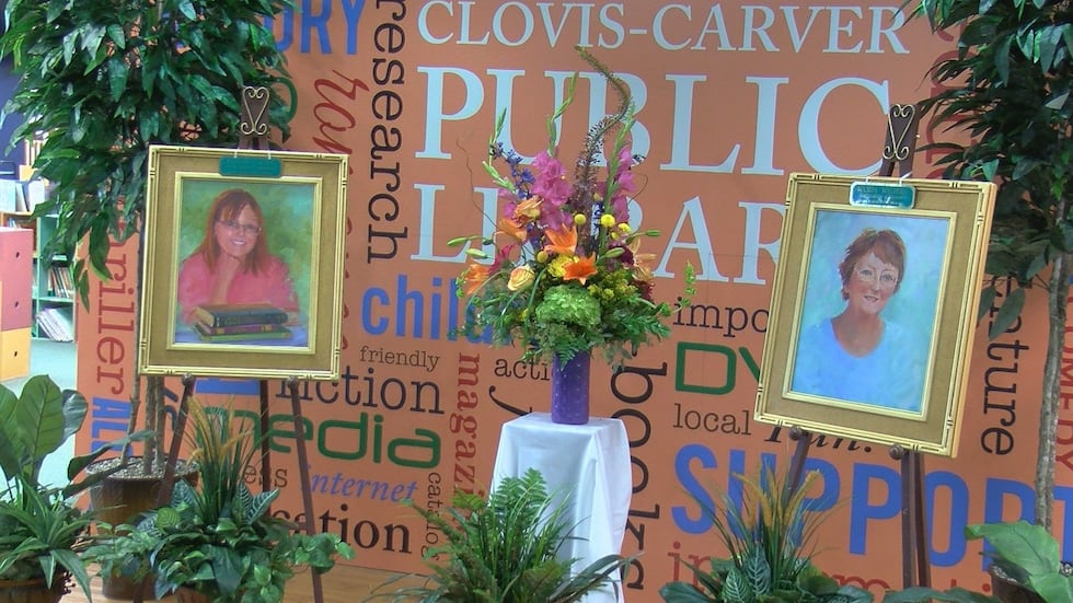 Mural paintings honoring Krissy Carter (left) and Wanda Walters (right) who were killed in the...