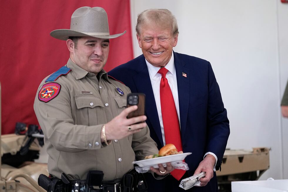 Republican presidential candidate and former President Donald Trump poses for a photo as he...