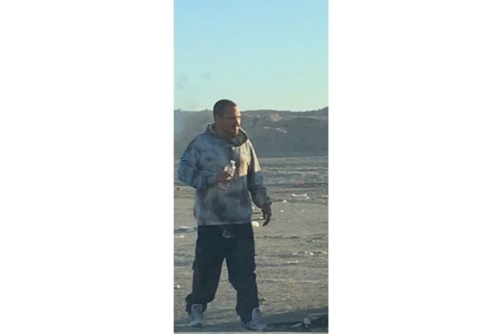 An unidentified man was found alive after taking a 40 minute ride in the back of a dump truck.