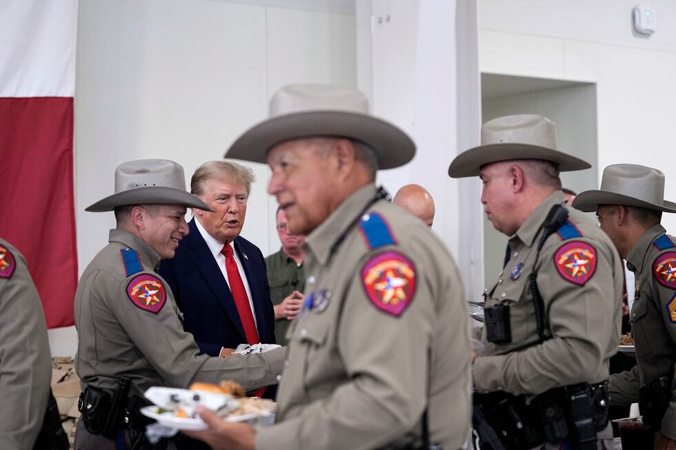 Republican presidential candidate and former President Donald Trump helps serve food to Texas...