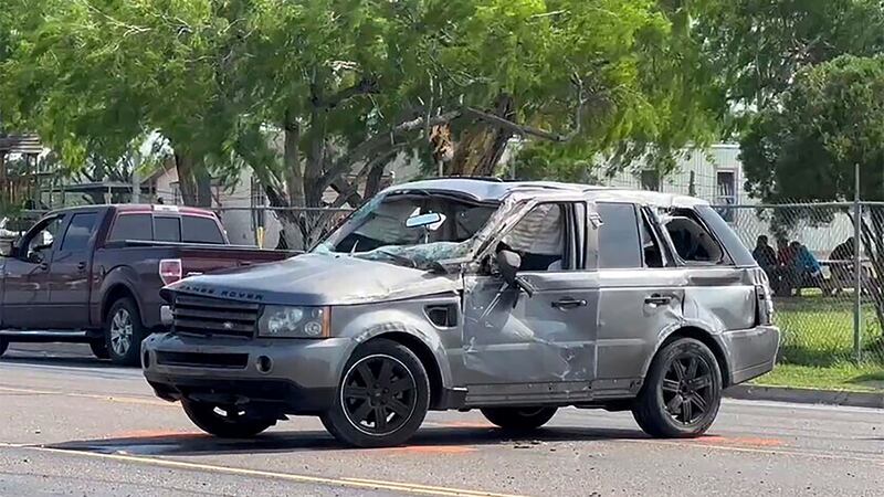 A damaged vehicle sits at the site of a deadly collision near a bus stop in Brownsville,...